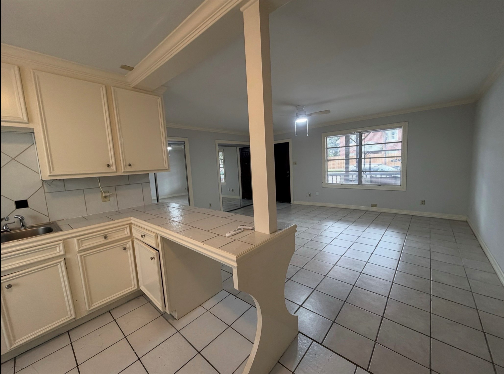613 Pacific Street, Unit 1 Houston, TX 77006 - Photo 13 of 28 a kitchen with a sink cabinets and stove