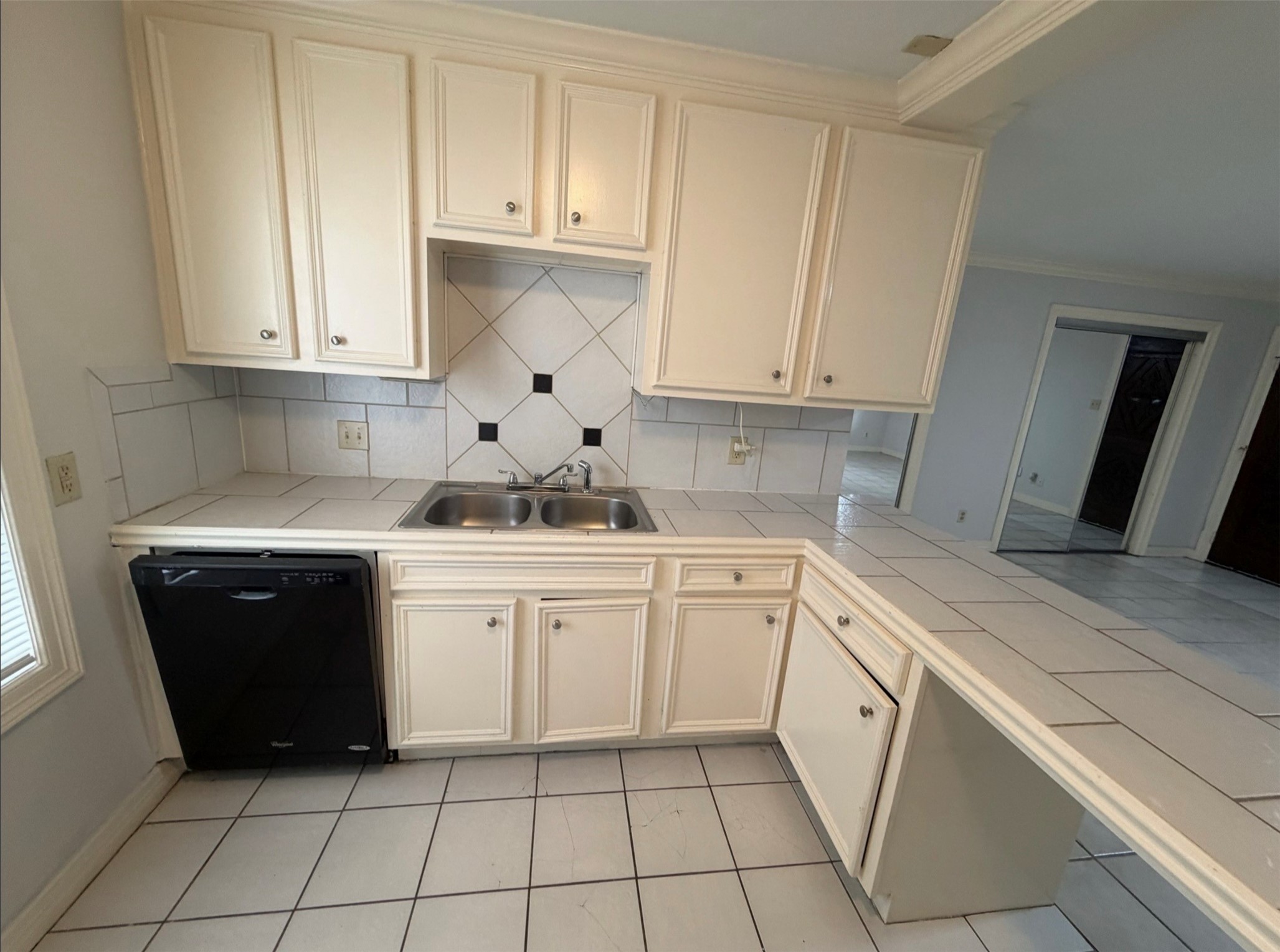 613 Pacific Street, Unit 1 Houston, TX 77006 - Photo 15 of 28 a kitchen with granite countertop white cabinets and white appliances