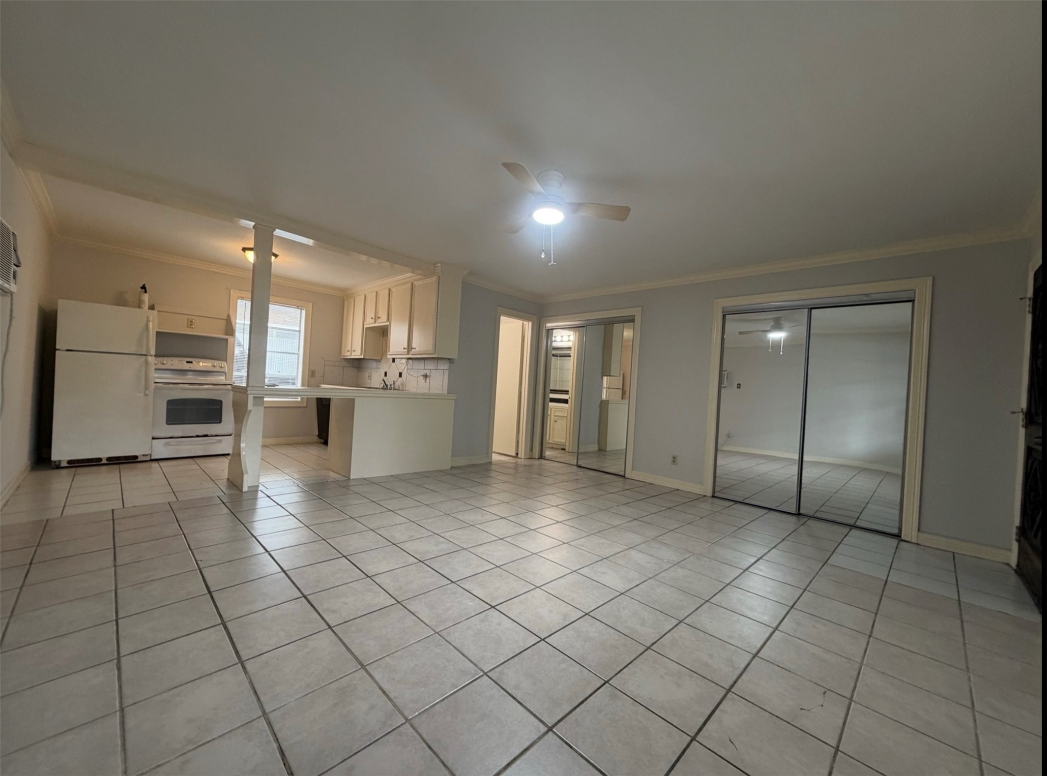 613 Pacific Street, Unit 1 Houston, TX 77006 - Photo 18 of 28 a view of a kitchen with a sink and an empty room