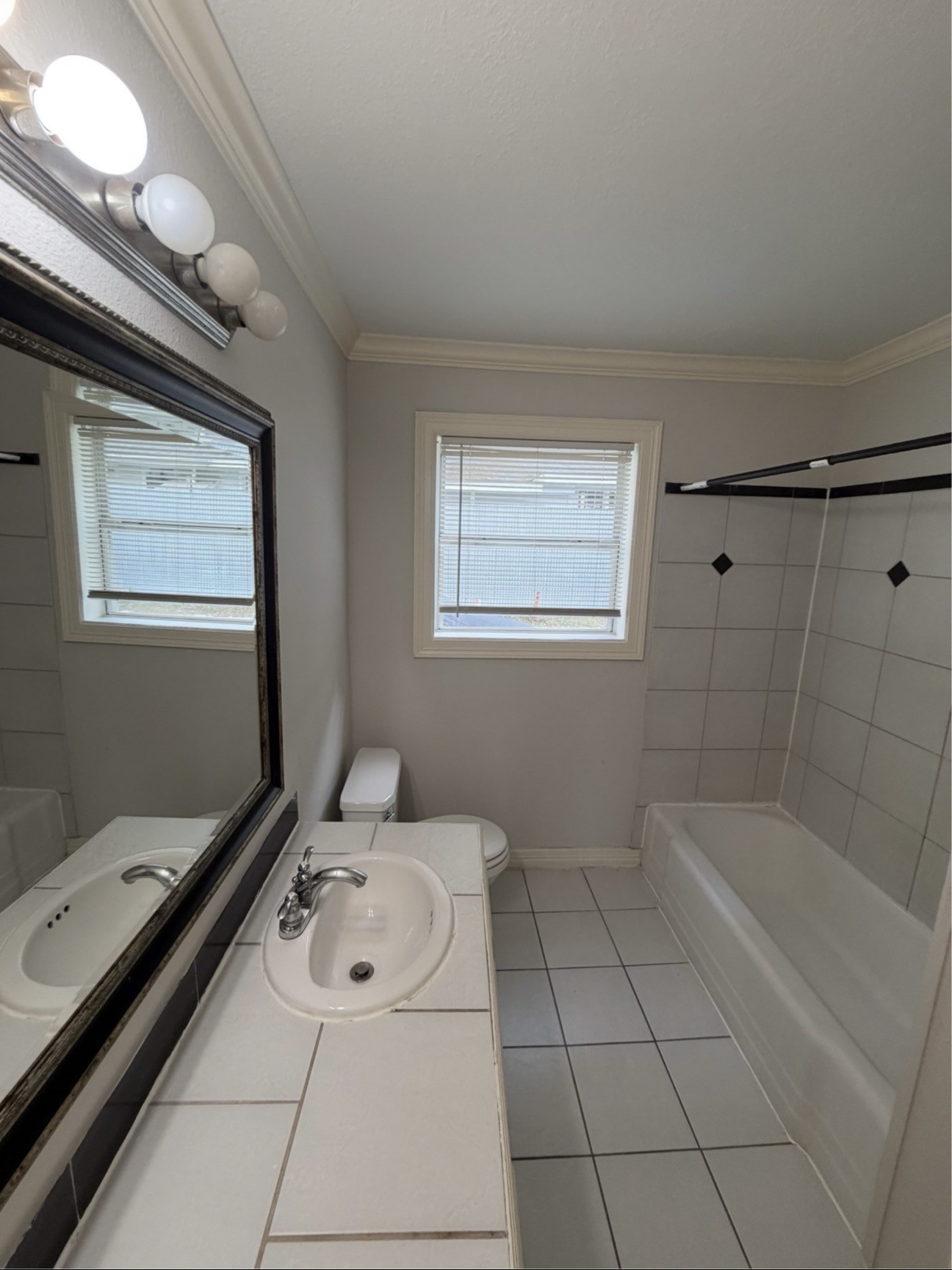 613 Pacific Street, Unit 1 Houston, TX 77006 - Photo 20 of 28 a bathroom with a tub sink toilet and vanity