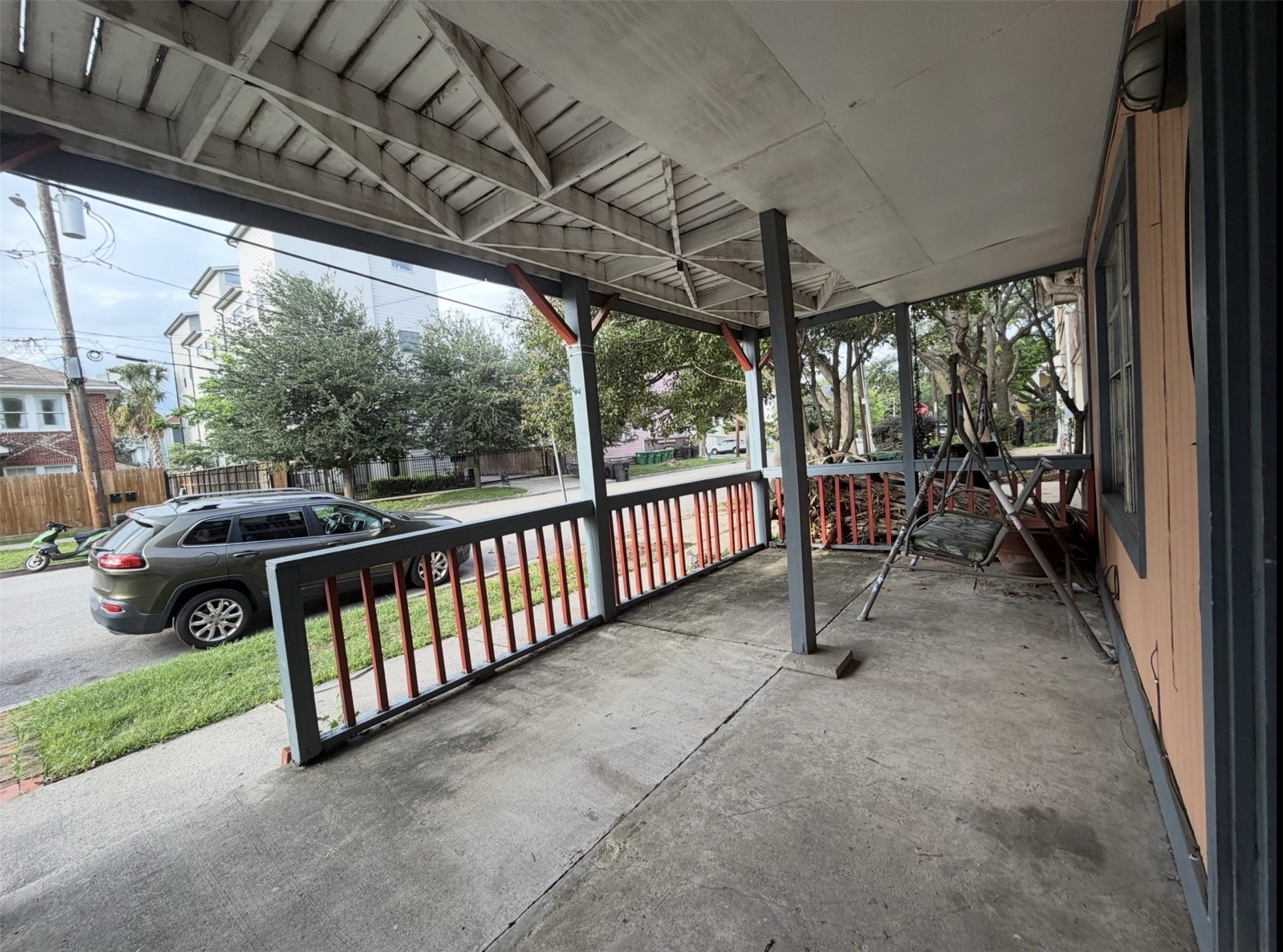 613 Pacific Street, Unit 1 Houston, TX 77006 - Photo 23 of 28 a view of a porch with furniture and a yard