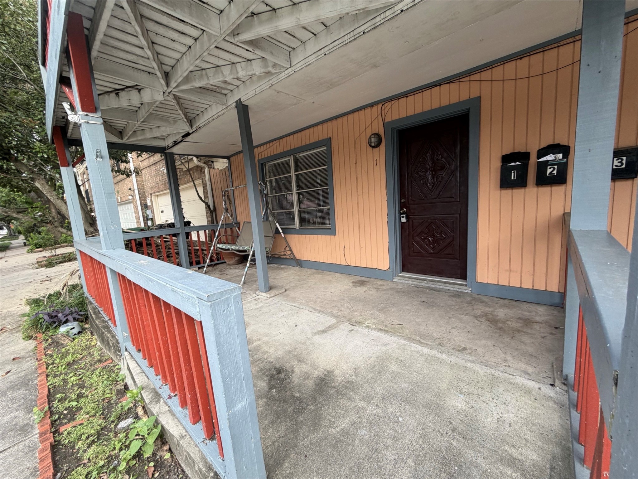 613 Pacific Street, Unit 1 Houston, TX 77006 - Photo 25 of 28 a view of a porch with wooden floor and fence