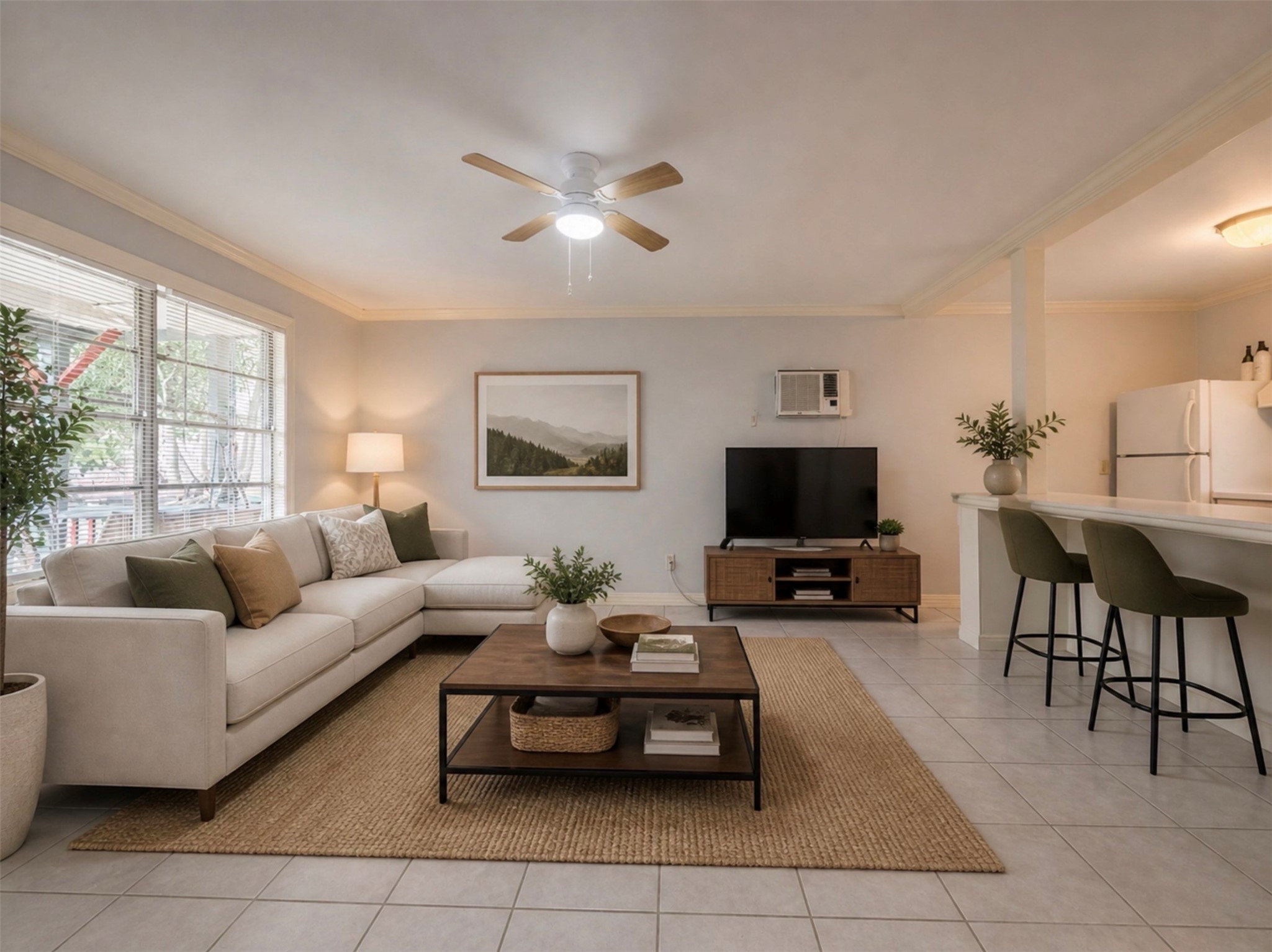 613 Pacific Street, Unit 1 Houston, TX 77006 - Photo 5 of 28 a living room with furniture and a flat screen tv