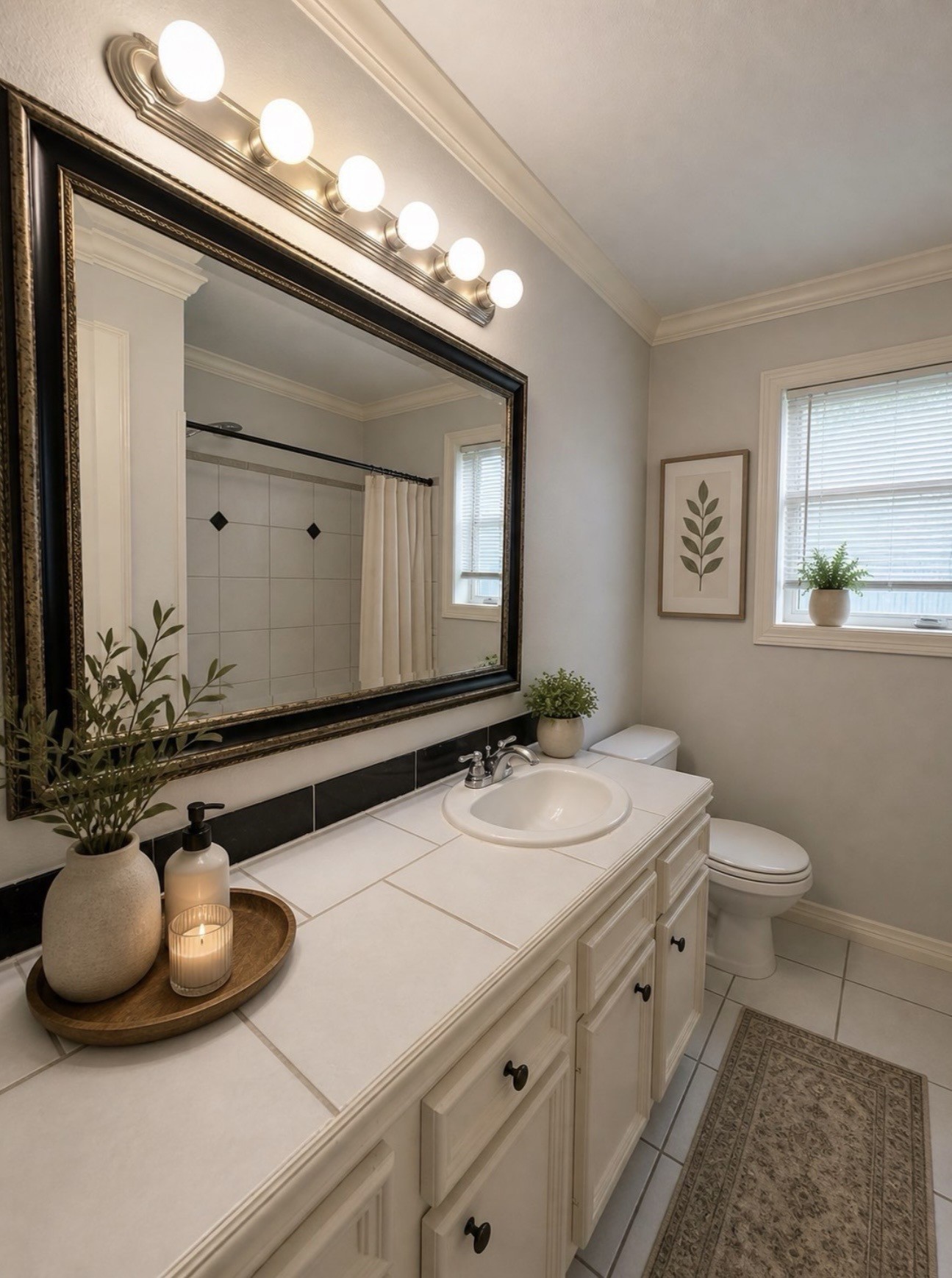 613 Pacific Street, Unit 1 Houston, TX 77006 - Photo 6 of 28 a bathroom with a double vanity sink and a mirror