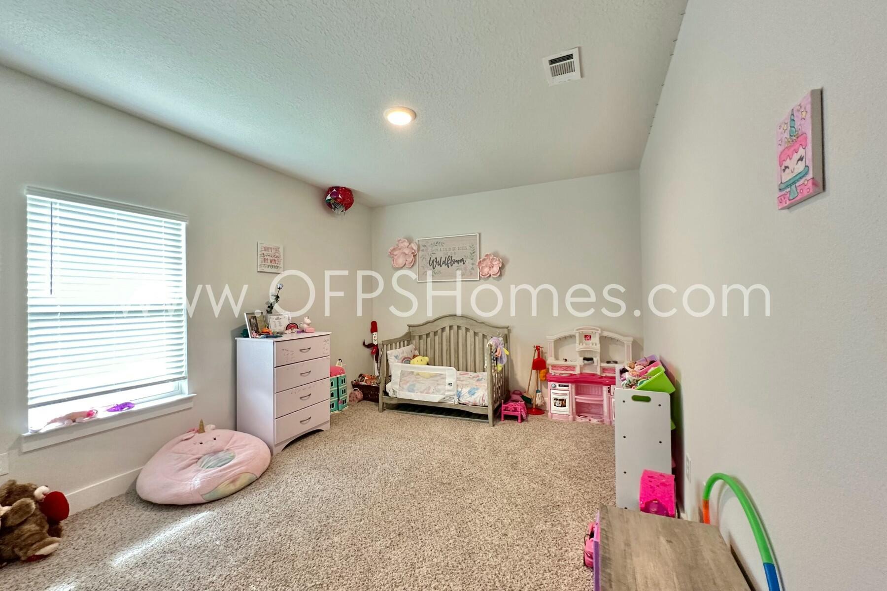 2412 Dakota Way Crestview, FL 32536 - Photo 11 of 43 a bedroom with furniture and a window