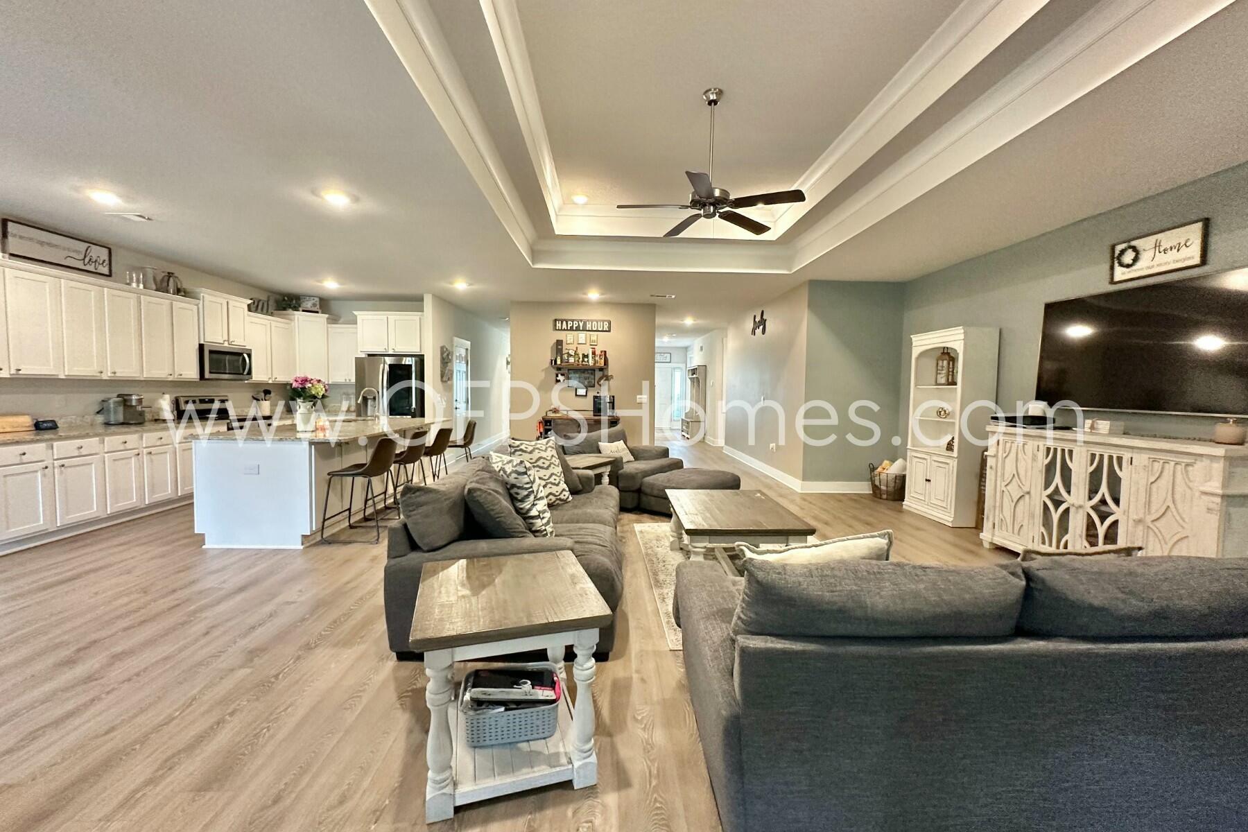2412 Dakota Way Crestview, FL 32536 - Photo 17 of 43 a living room with furniture and a flat screen tv