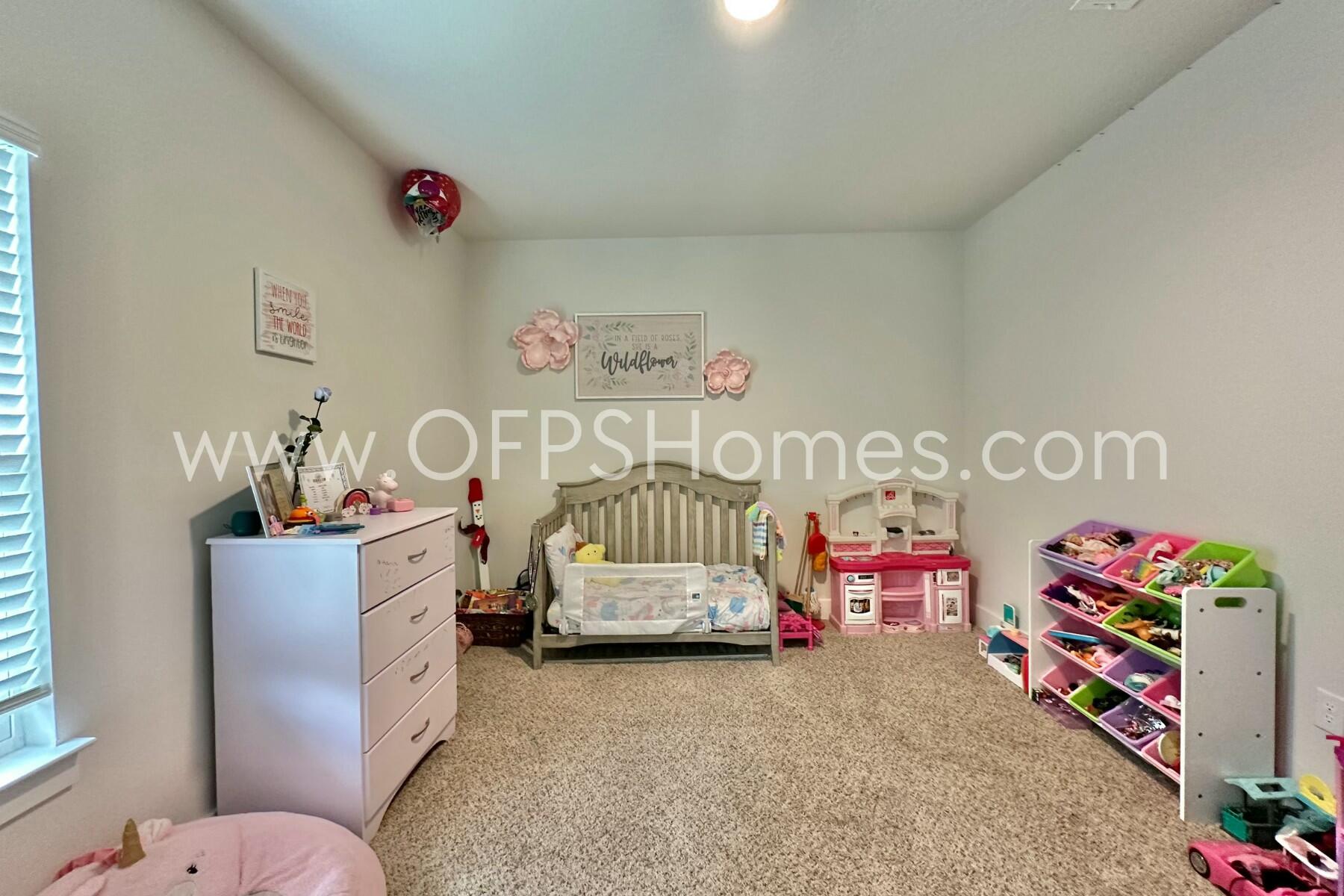 2412 Dakota Way Crestview, FL 32536 - Photo 18 of 43 a bedroom with toys and a bed