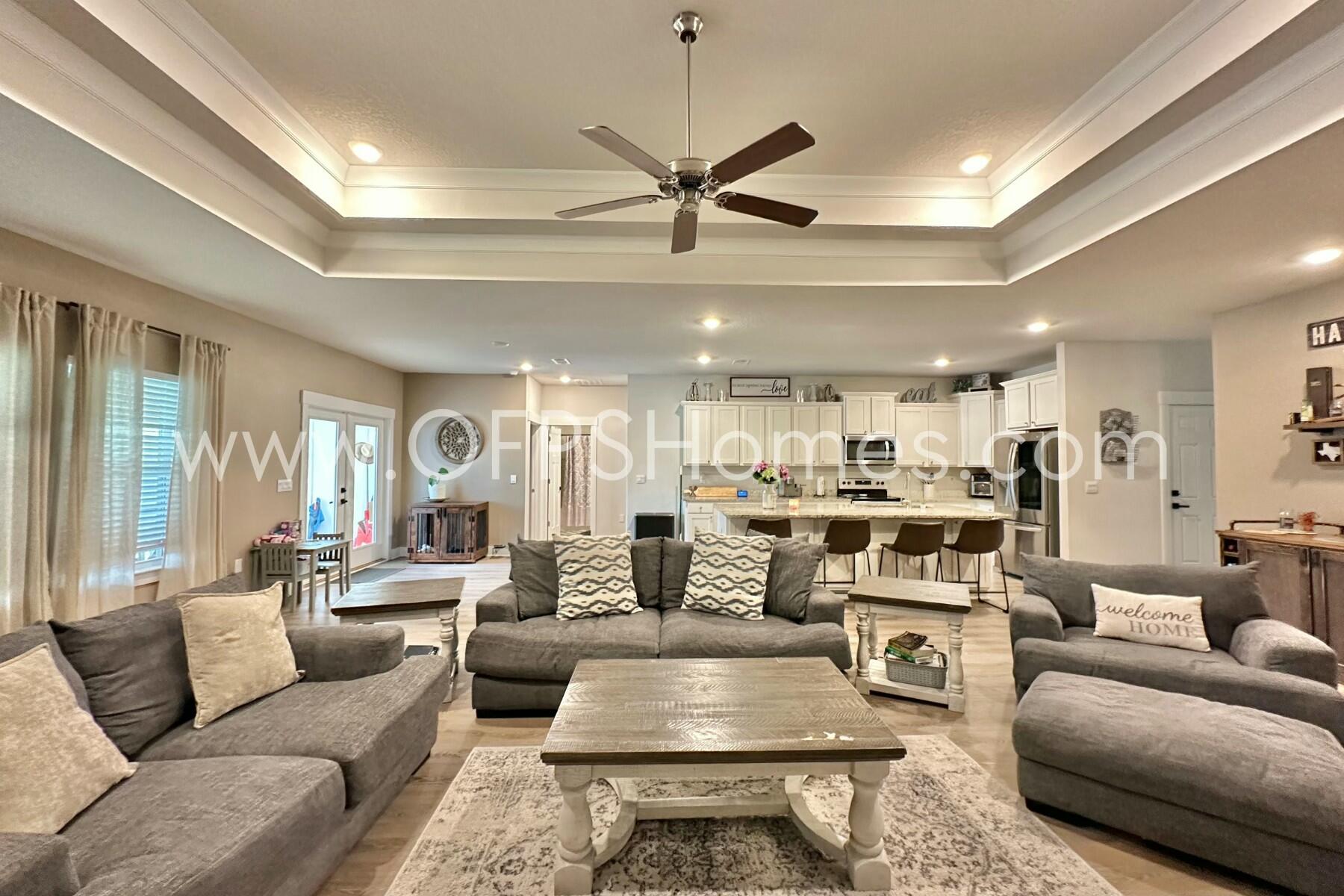 2412 Dakota Way Crestview, FL 32536 - Photo 21 of 43 a living room with furniture kitchen view and a large window