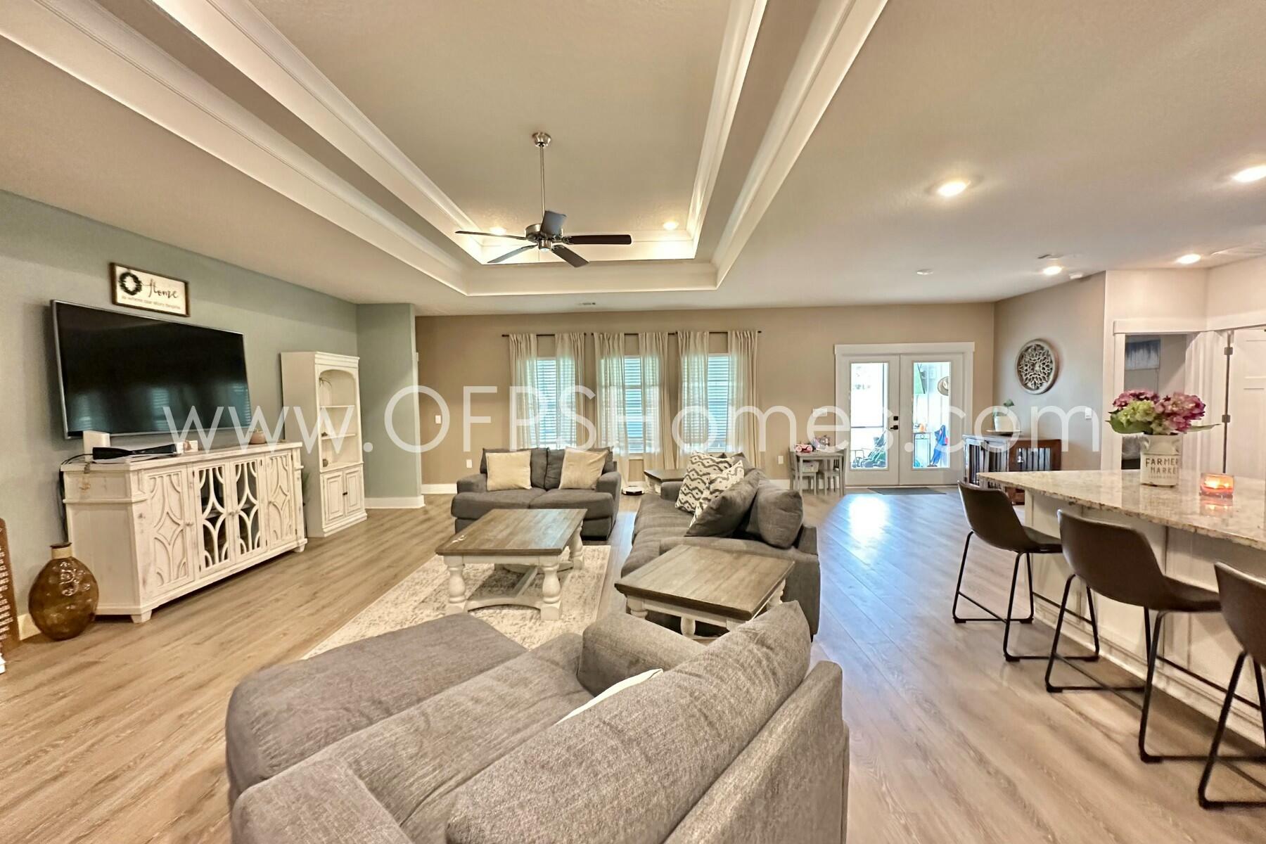 2412 Dakota Way Crestview, FL 32536 - Photo 30 of 43 a living room with furniture and a flat screen tv