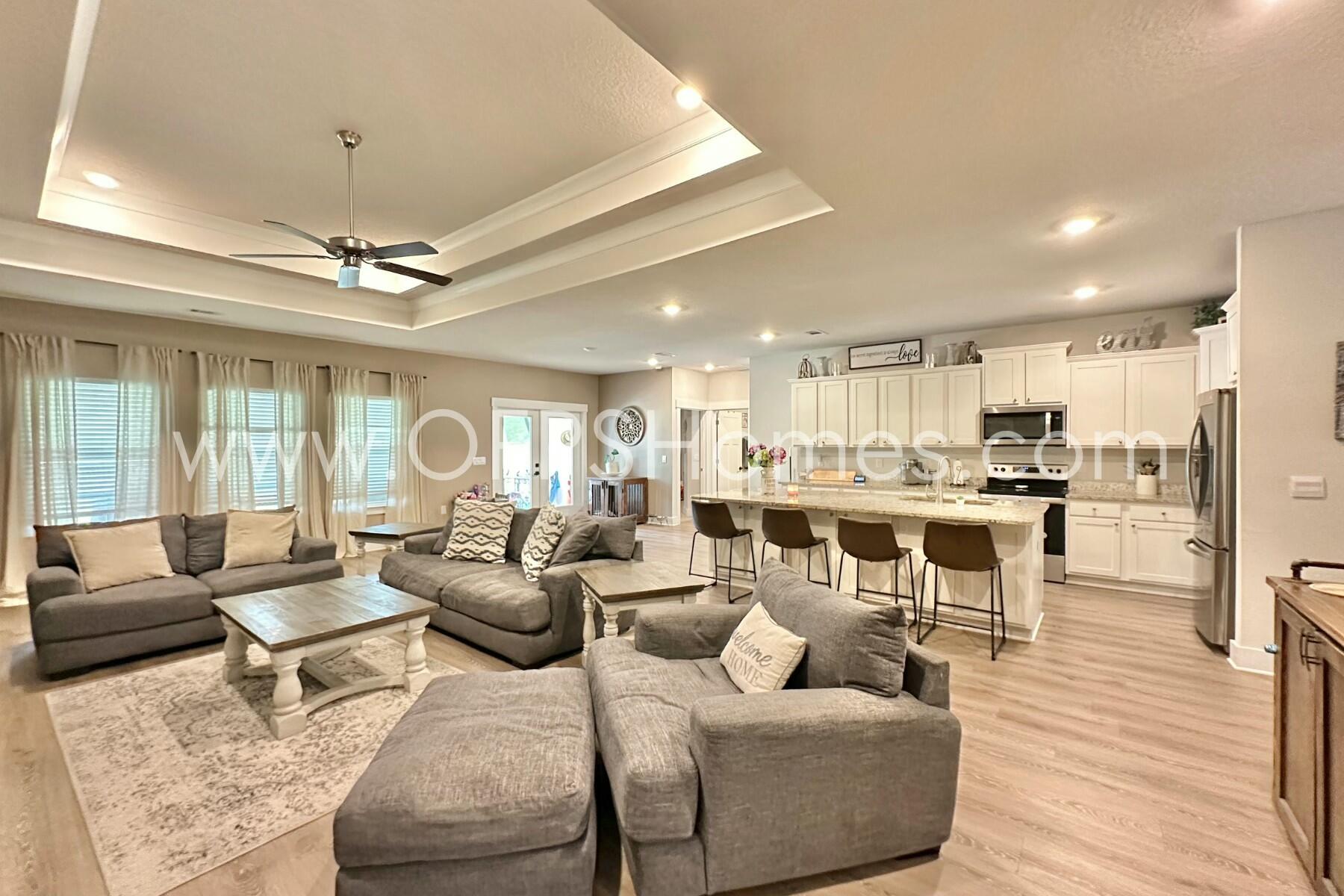 2412 Dakota Way Crestview, FL 32536 - Photo 33 of 43 a living room with furniture and a view of kitchen