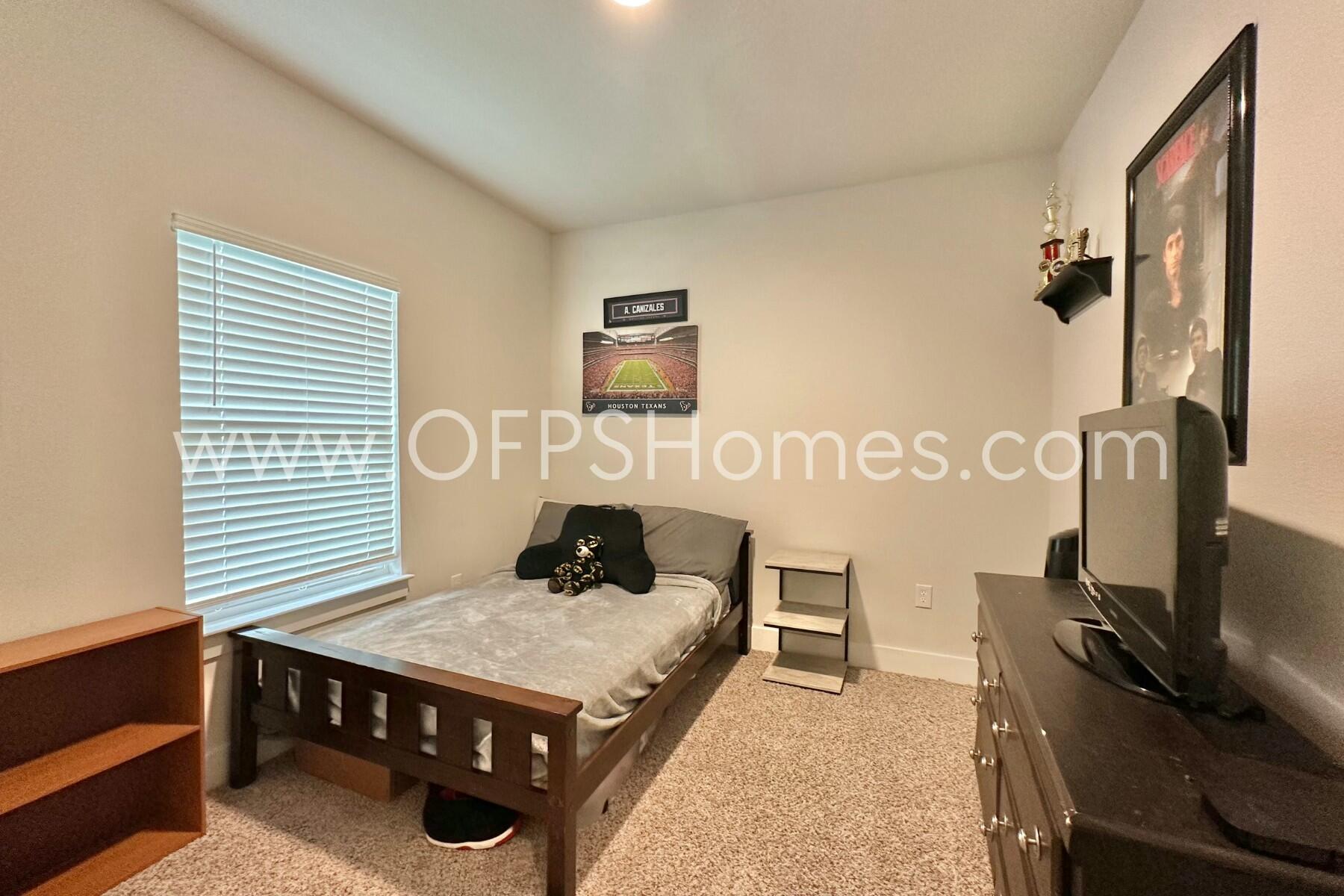 2412 Dakota Way Crestview, FL 32536 - Photo 37 of 43 a living room with a bed furniture and a window
