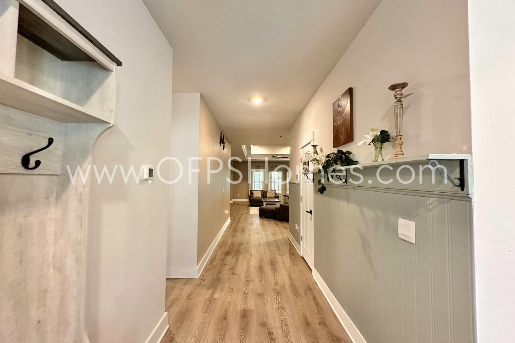 2412 Dakota Way Crestview, FL 32536 - Photo 38 of 43 a view of a hallway with wooden floor