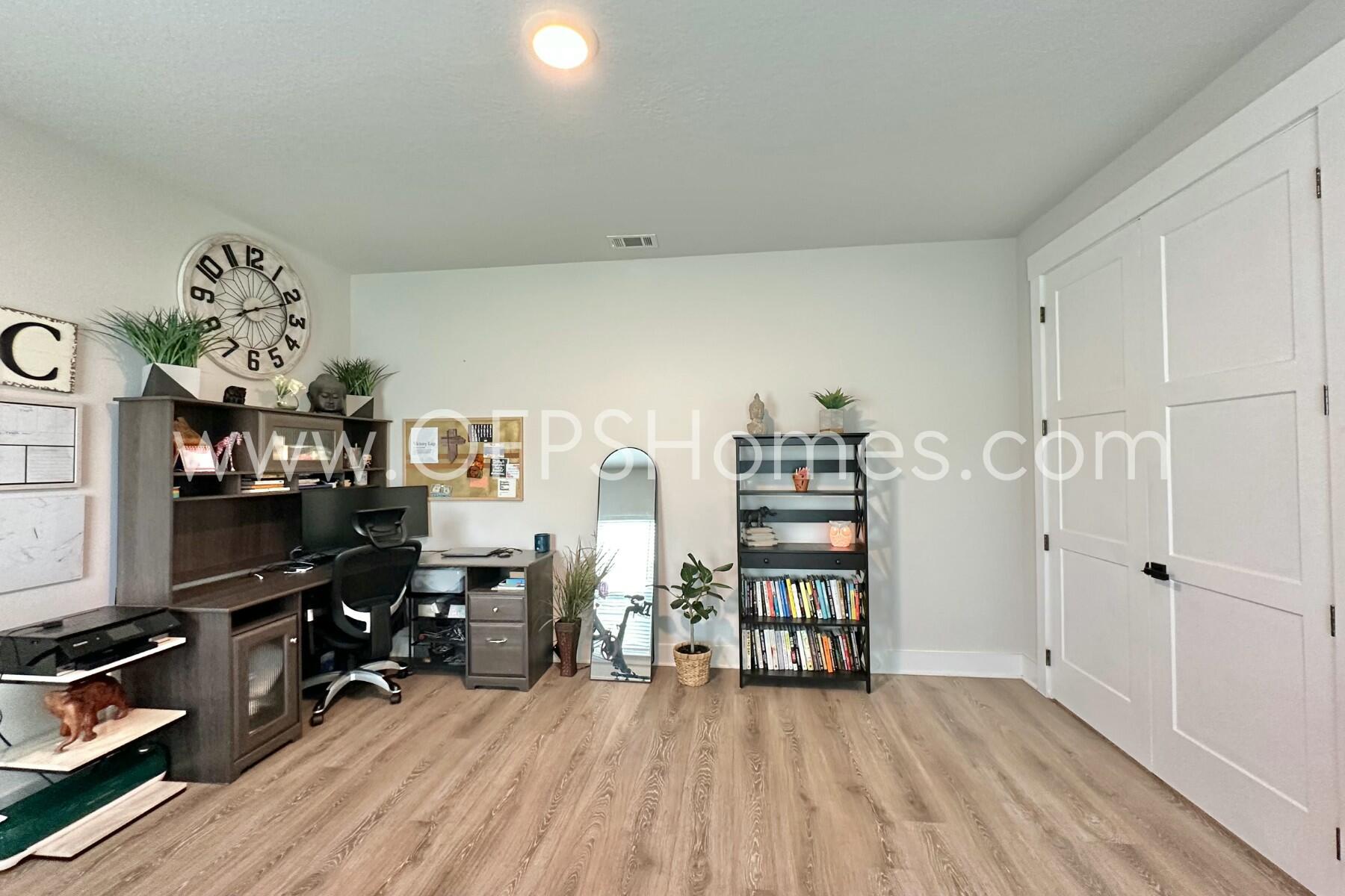 2412 Dakota Way Crestview, FL 32536 - Photo 41 of 43 a view of a workspace with furniture and wooden floor