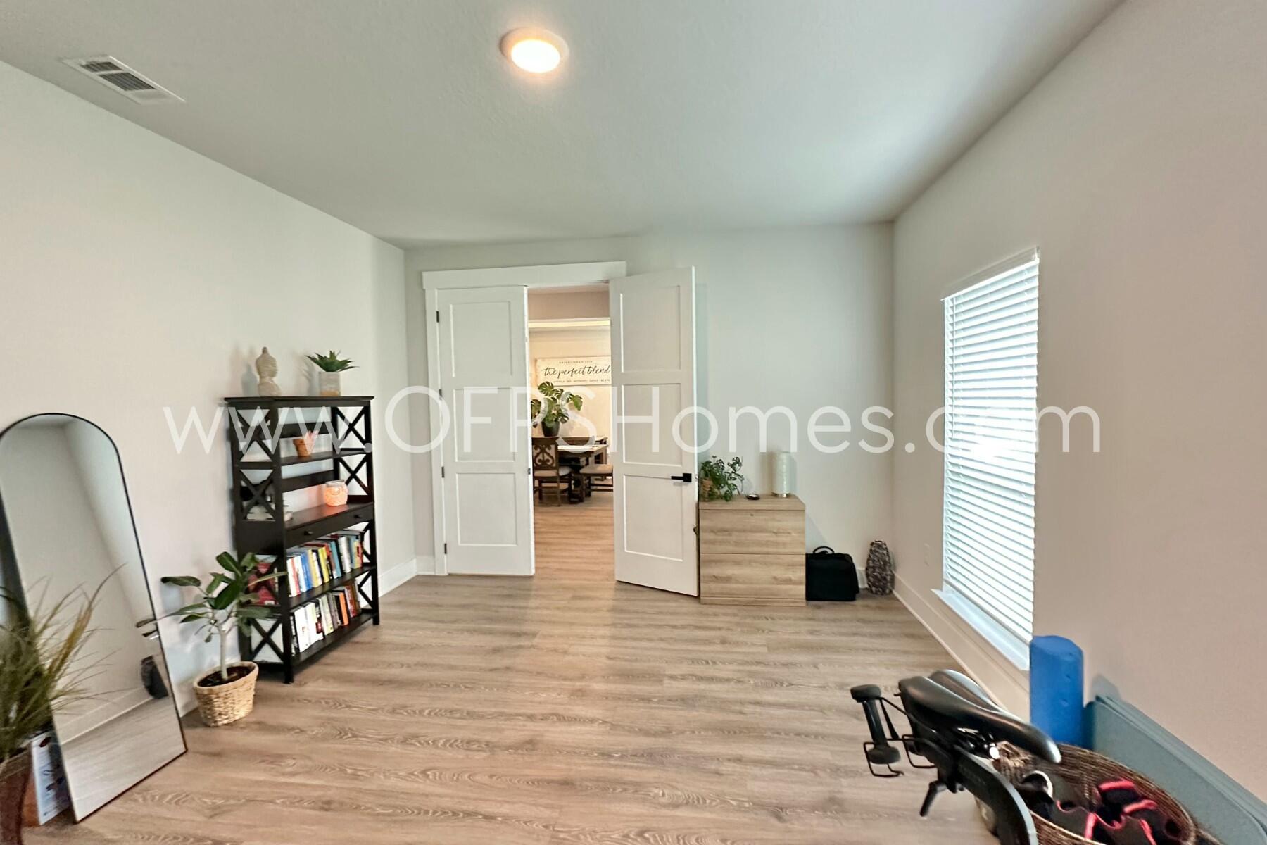 2412 Dakota Way Crestview, FL 32536 - Photo 42 of 43 a living room with furniture and a wooden floor