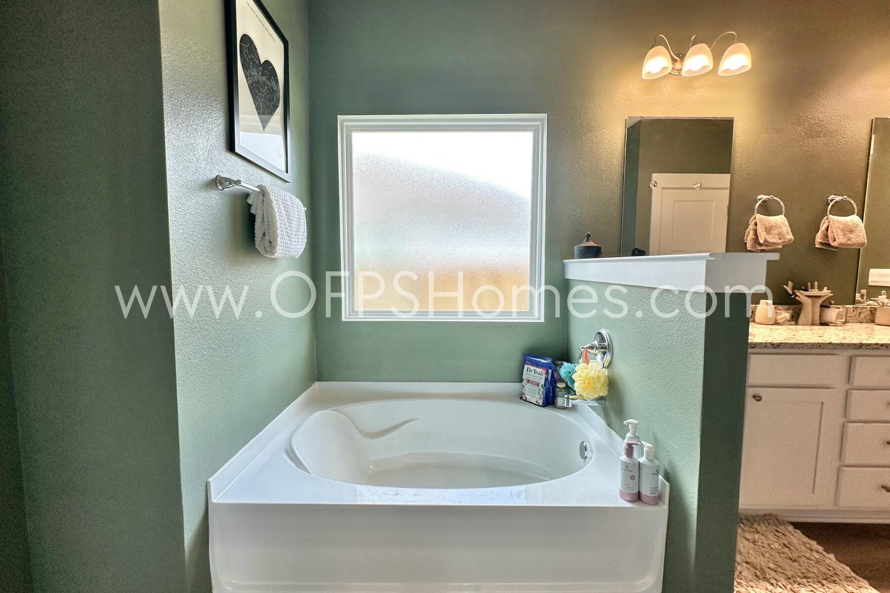 2412 Dakota Way Crestview, FL 32536 - Photo 6 of 43 a bathroom with a tub a sink and a window