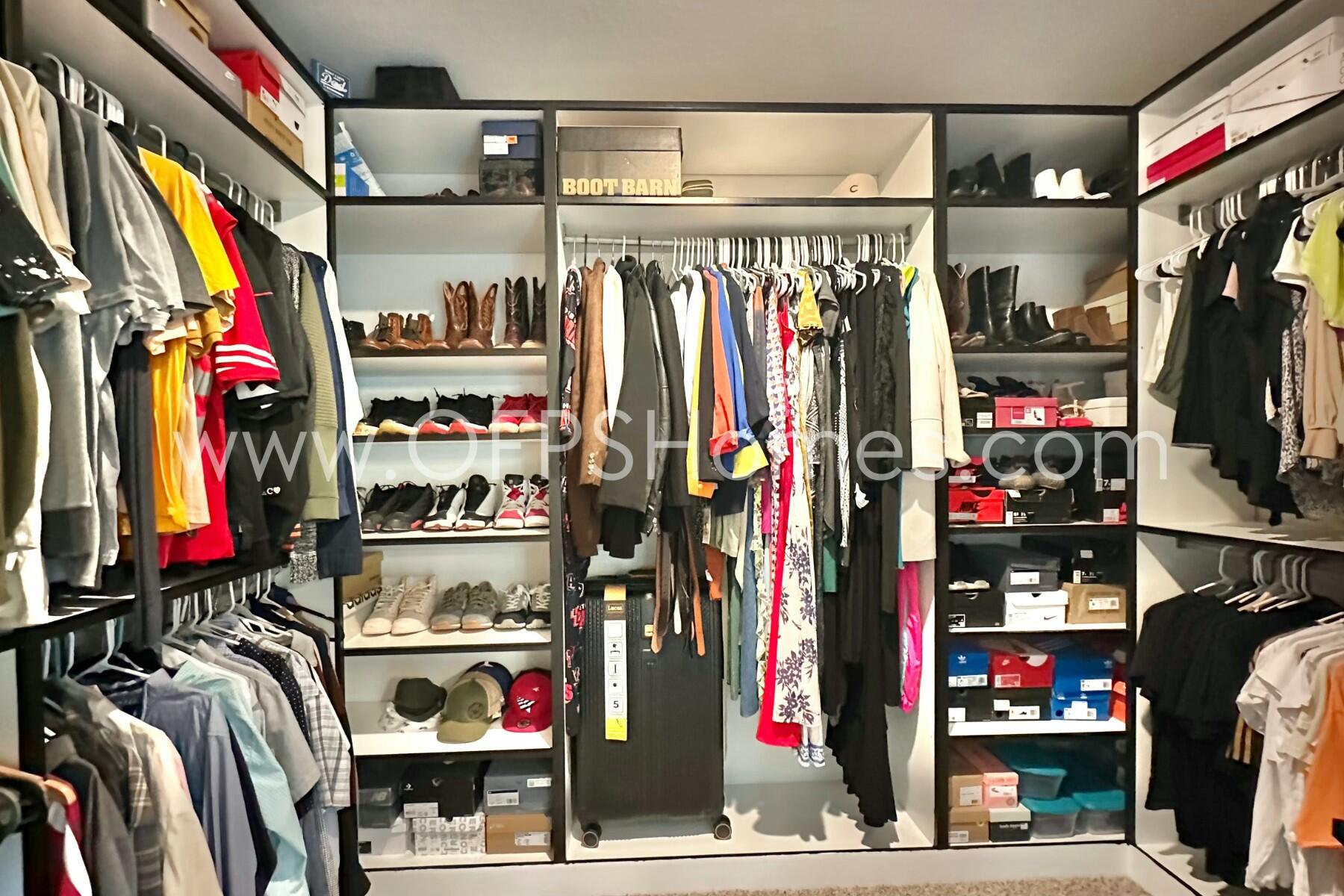 2412 Dakota Way Crestview, FL 32536 - Photo 8 of 43 a view of walk in closet with clothes