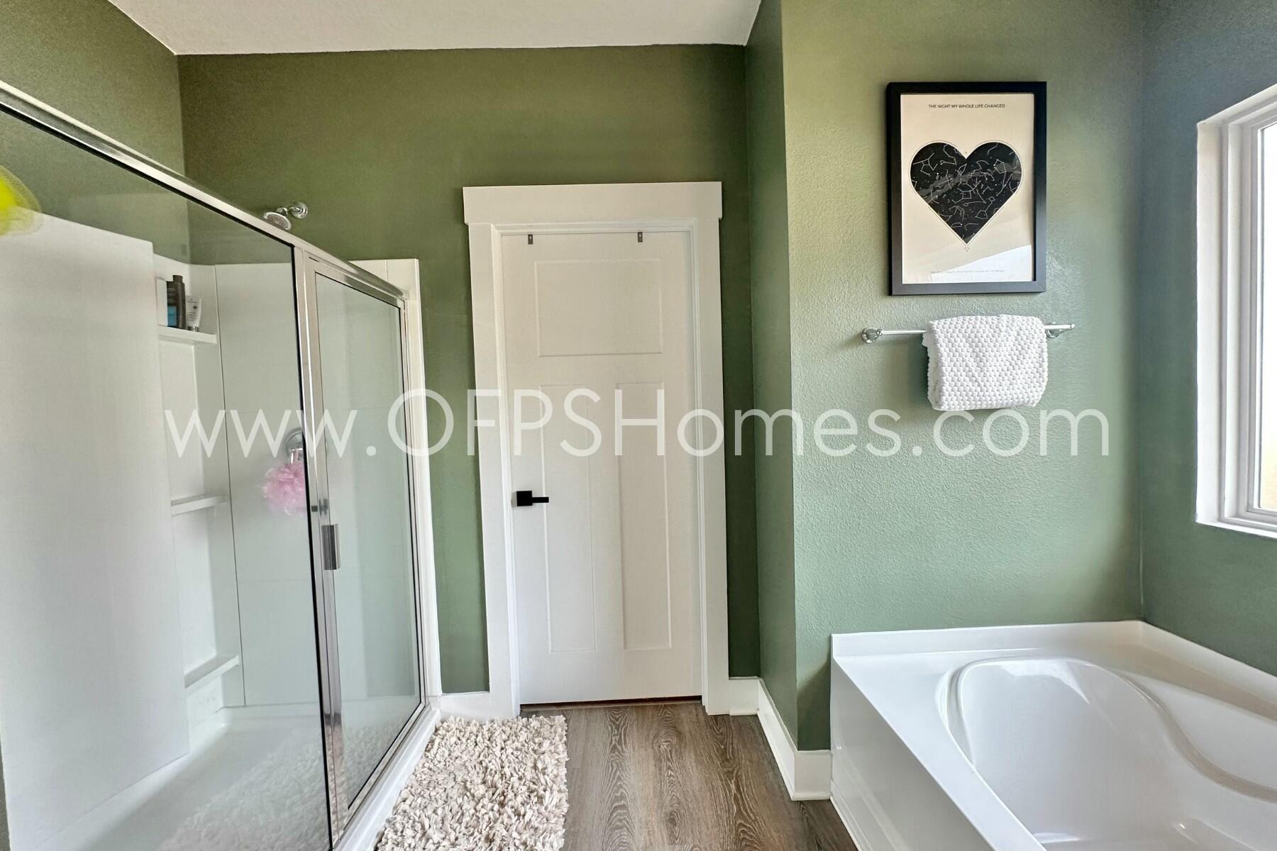 2412 Dakota Way Crestview, FL 32536 - Photo 10 of 43 a bathroom with a bathtub and a shower