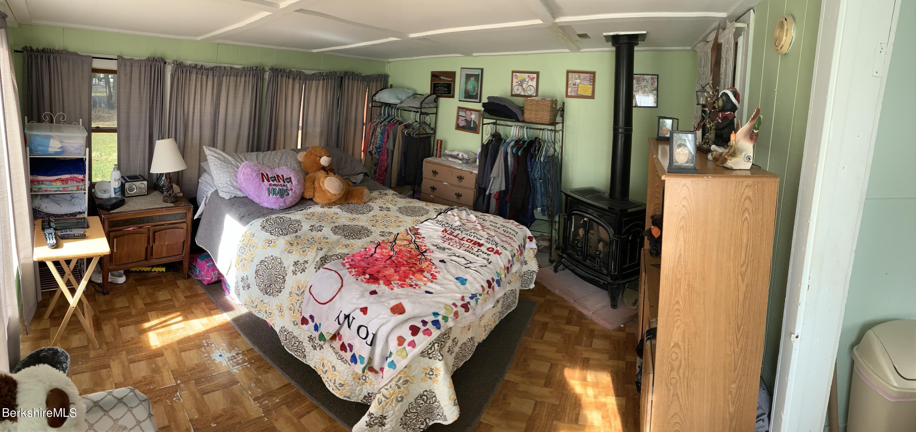 20 Prospect Street Adams, MA 01220 - Photo 15 of 40 a bed sitting in a bedroom next to a window