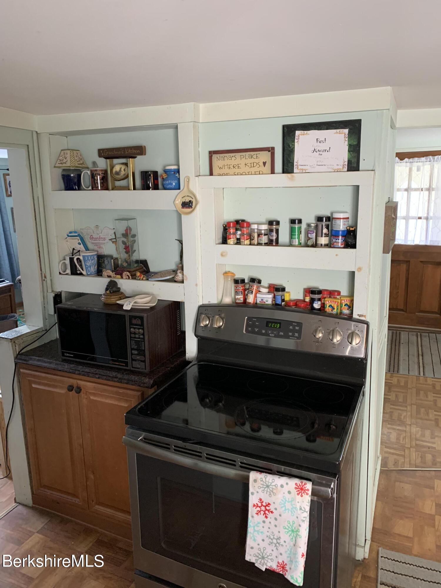 20 Prospect Street Adams, MA 01220 - Photo 17 of 40 a kitchen with a stove and cabinets