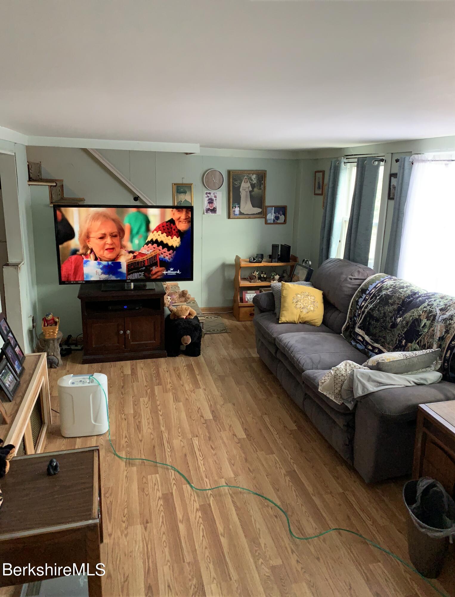 20 Prospect Street Adams, MA 01220 - Photo 22 of 40 a living room with furniture and a flat screen tv