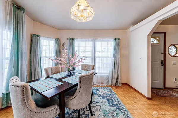 a view of a dining room with furniture and window