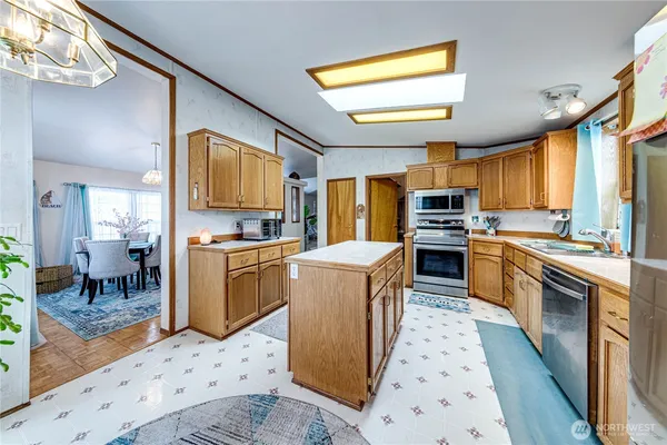 a kitchen with cabinets and furniture