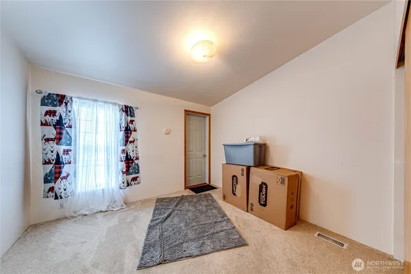 a view of a livingroom with furniture and toys