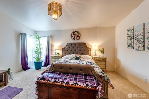 a bedroom with a bed and window