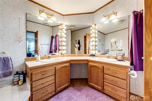 a bathroom with a sink vanity and mirror