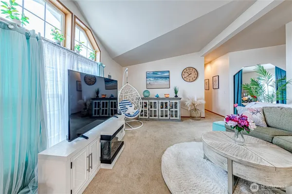 a living room with furniture and a large window