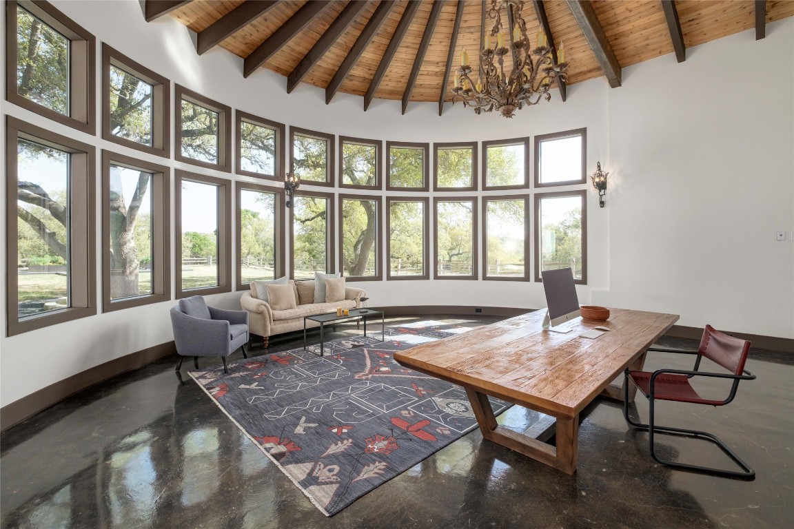 9770 Farm To Market 967 Buda, TX 78610 - Photo 12 of 40 a living room with furniture and a large window