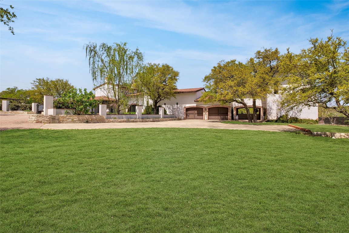 9770 Farm To Market 967 Buda, TX 78610 - Photo 2 of 40 a house view with outdoor space and sitting space