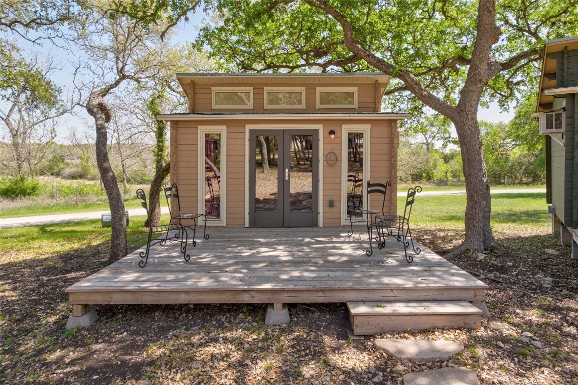 9770 Farm To Market 967 Buda, TX 78610 - Photo 29 of 40 a view of a house with backyard porch and sitting area