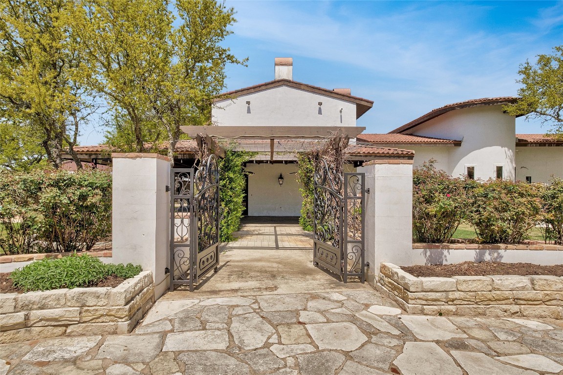 9770 Farm To Market 967 Buda, TX 78610 - Photo 3 of 40 a front view of a house with a porch