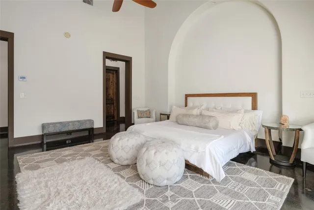a spacious en suite bathroom with a double vanity sink and a mirror