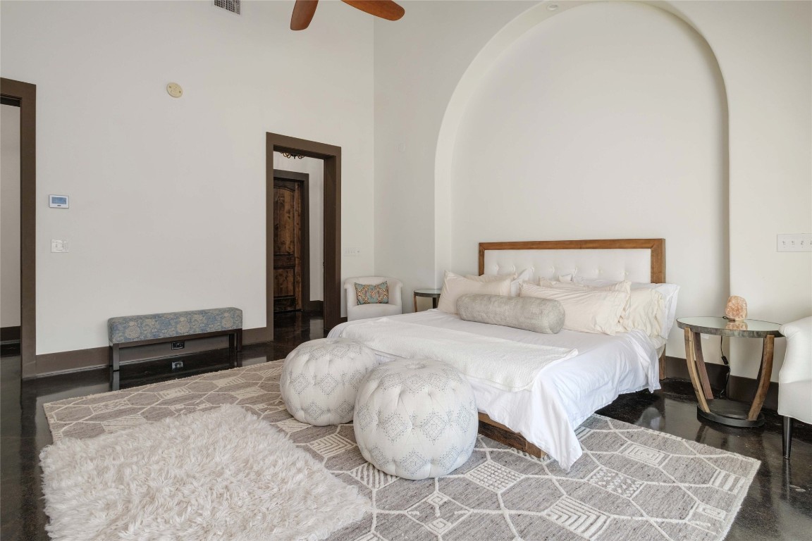 9770 Farm To Market 967 Buda, TX 78610 - Photo 8 of 40 a bedroom with a bed and wooden floor