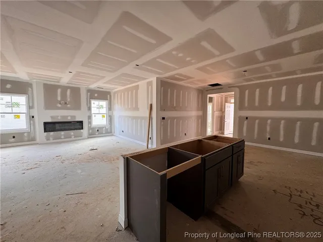 a kitchen with cabinets and window