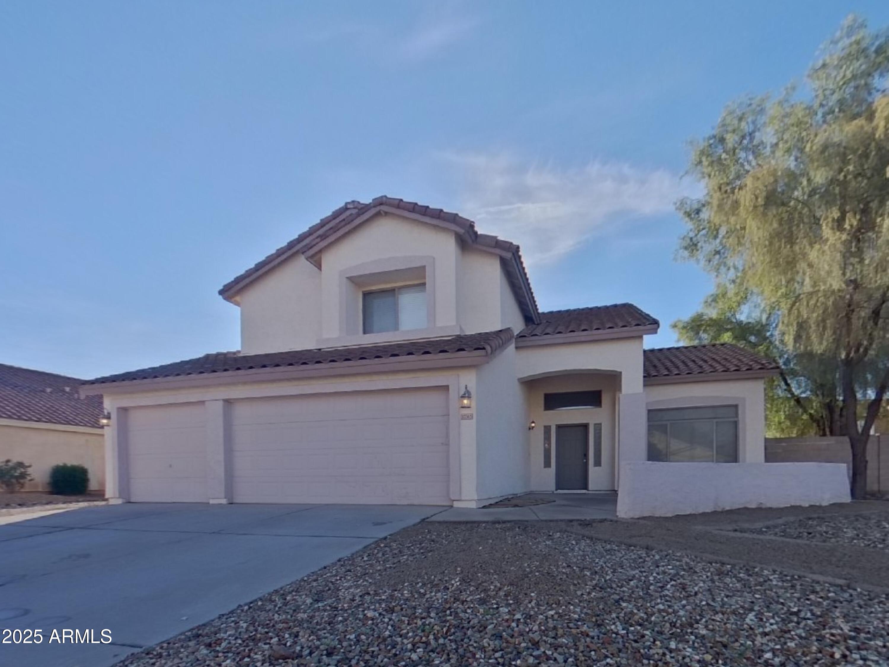 10365 West Piccadilly Road Avondale, AZ 85392 - Photo 1 of 20 a front view of a house with a yard