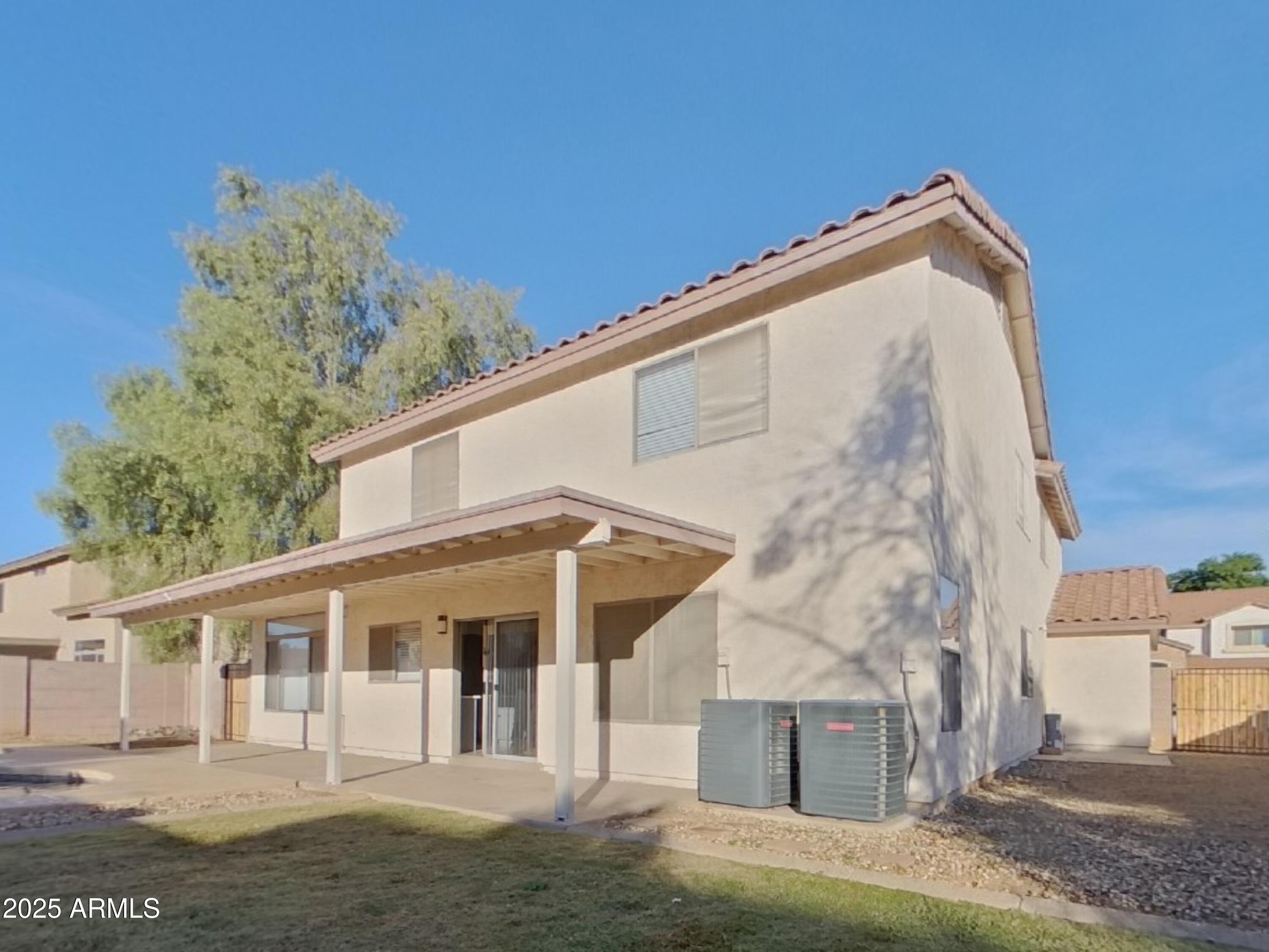 10365 West Piccadilly Road Avondale, AZ 85392 - Photo 19 of 20 a view of a house with a yard