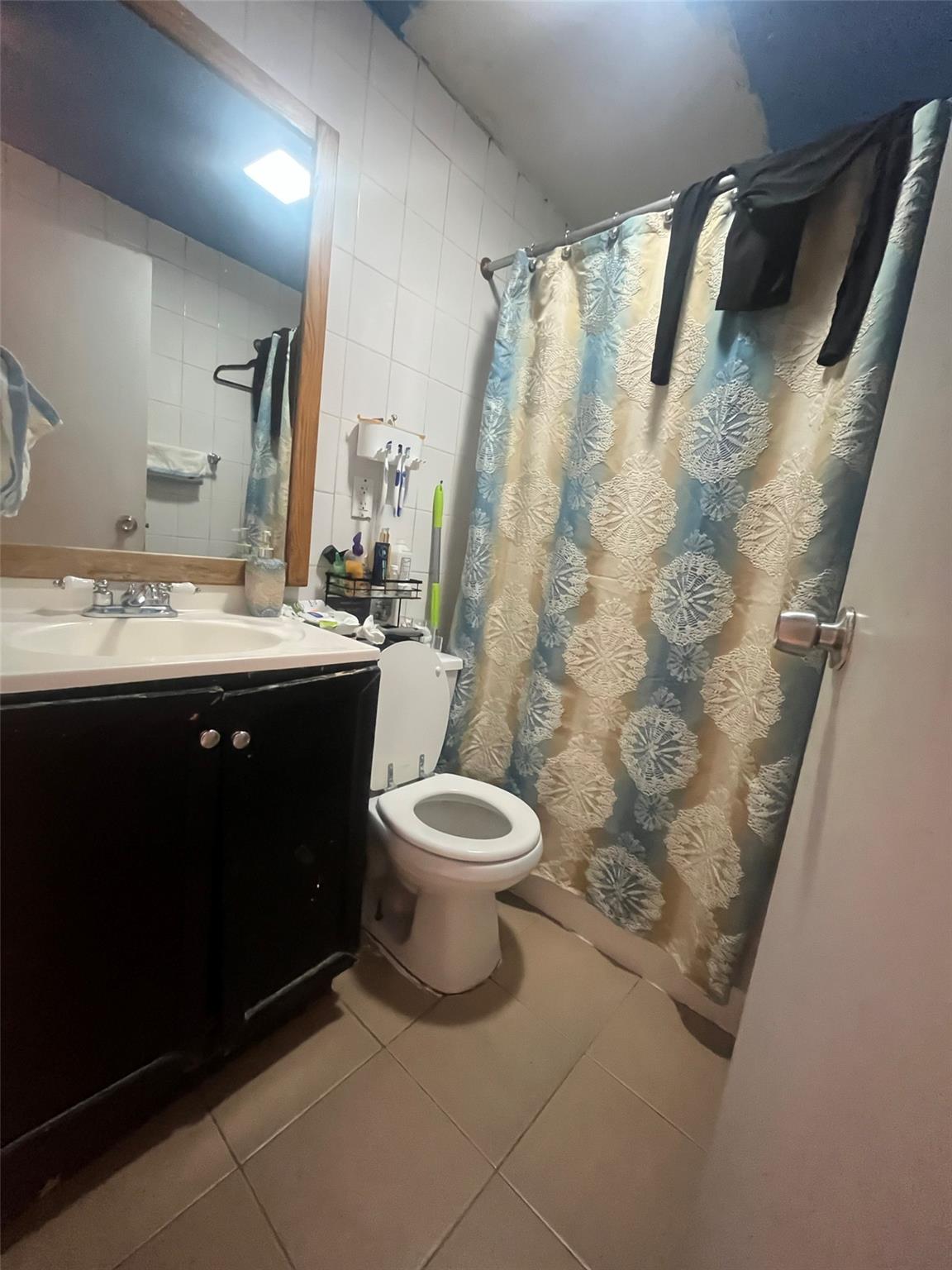 43-10 111th Street Queens, NY 11368 - Photo 7 of 7 a bathroom with a granite countertop sink toilet and shower