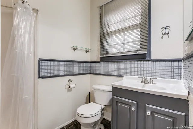 a bathroom with a sink and a toilet