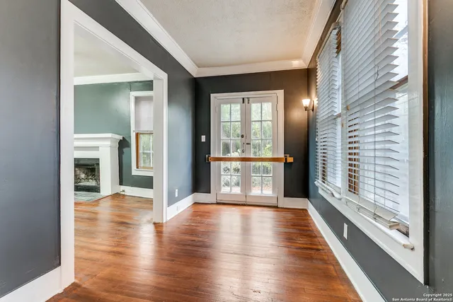 a view of an entryway with wooden floor