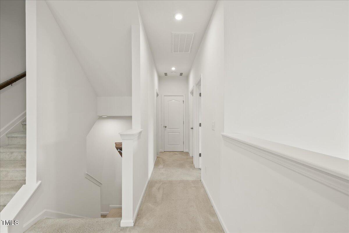 1610 Stone Road Durham, NC 27703 - Photo 17 of 40 a view of a bathroom with white walls