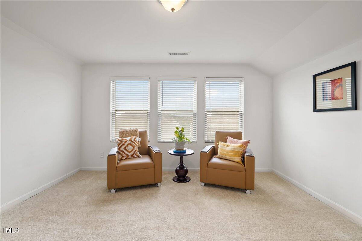 1610 Stone Road Durham, NC 27703 - Photo 21 of 40 a living room with furniture and a large window