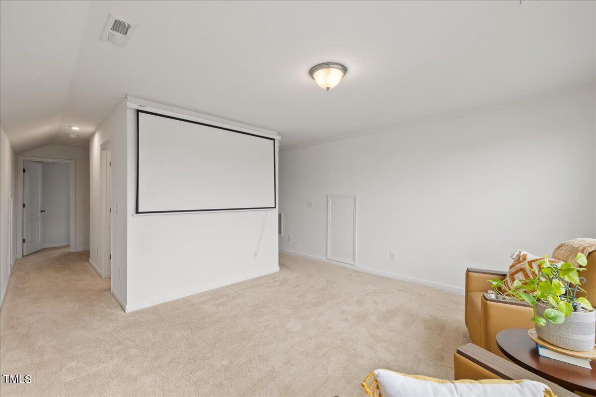 1610 Stone Road Durham, NC 27703 - Photo 22 of 40 a view of an empty room with a kitchen