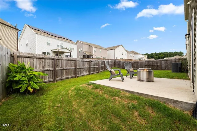 a view of a house with sitting area and furniture