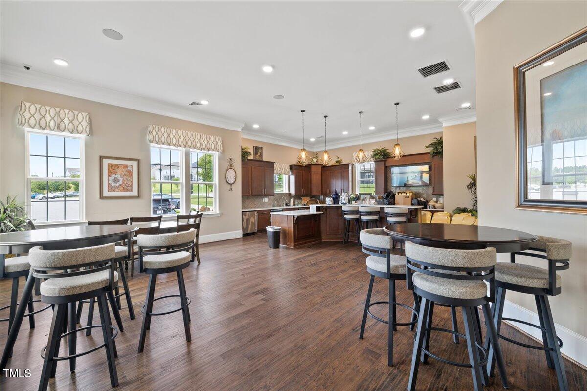 1610 Stone Road Durham, NC 27703 - Photo 32 of 40 a view of a dining room with furniture and a livingroom