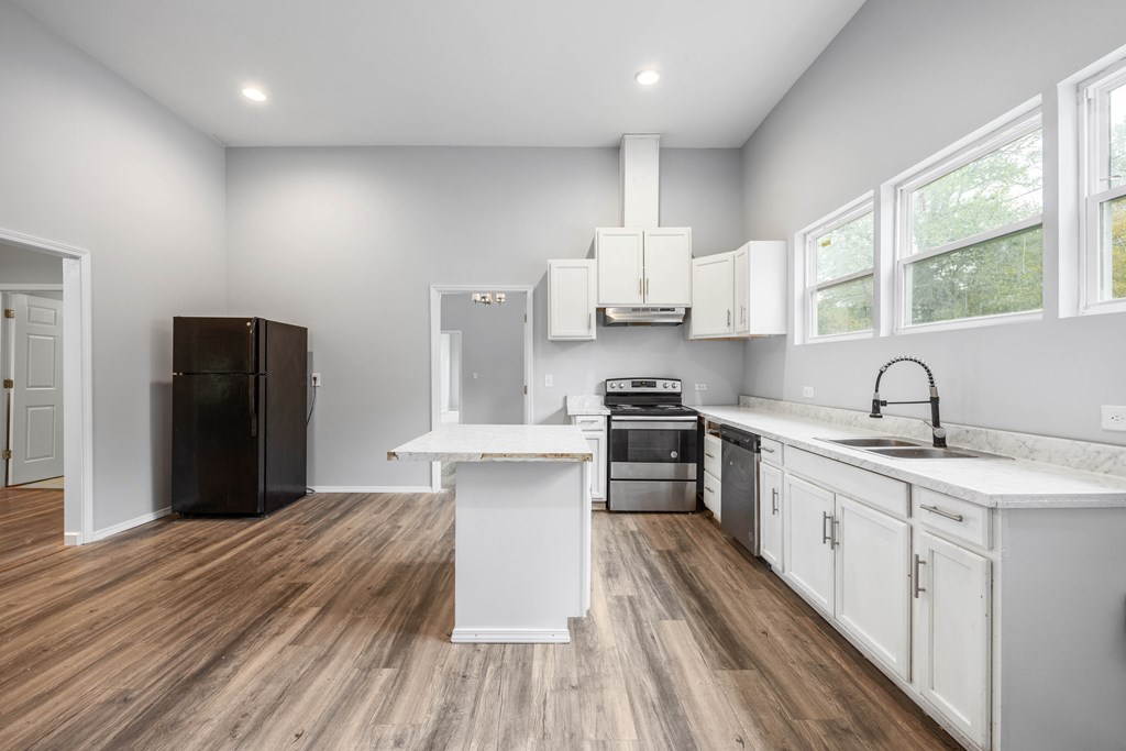2113 Summerville Road Phenix City, AL 36867 - Photo 17 of 37 a kitchen with stainless steel appliances a refrigerator sink and cabinets