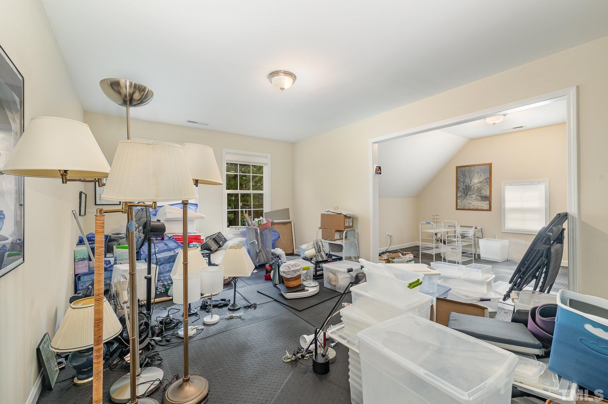 306 Few Circle Durham, NC 27705 - Photo 20 of 28 a room with gym equipment and a large window