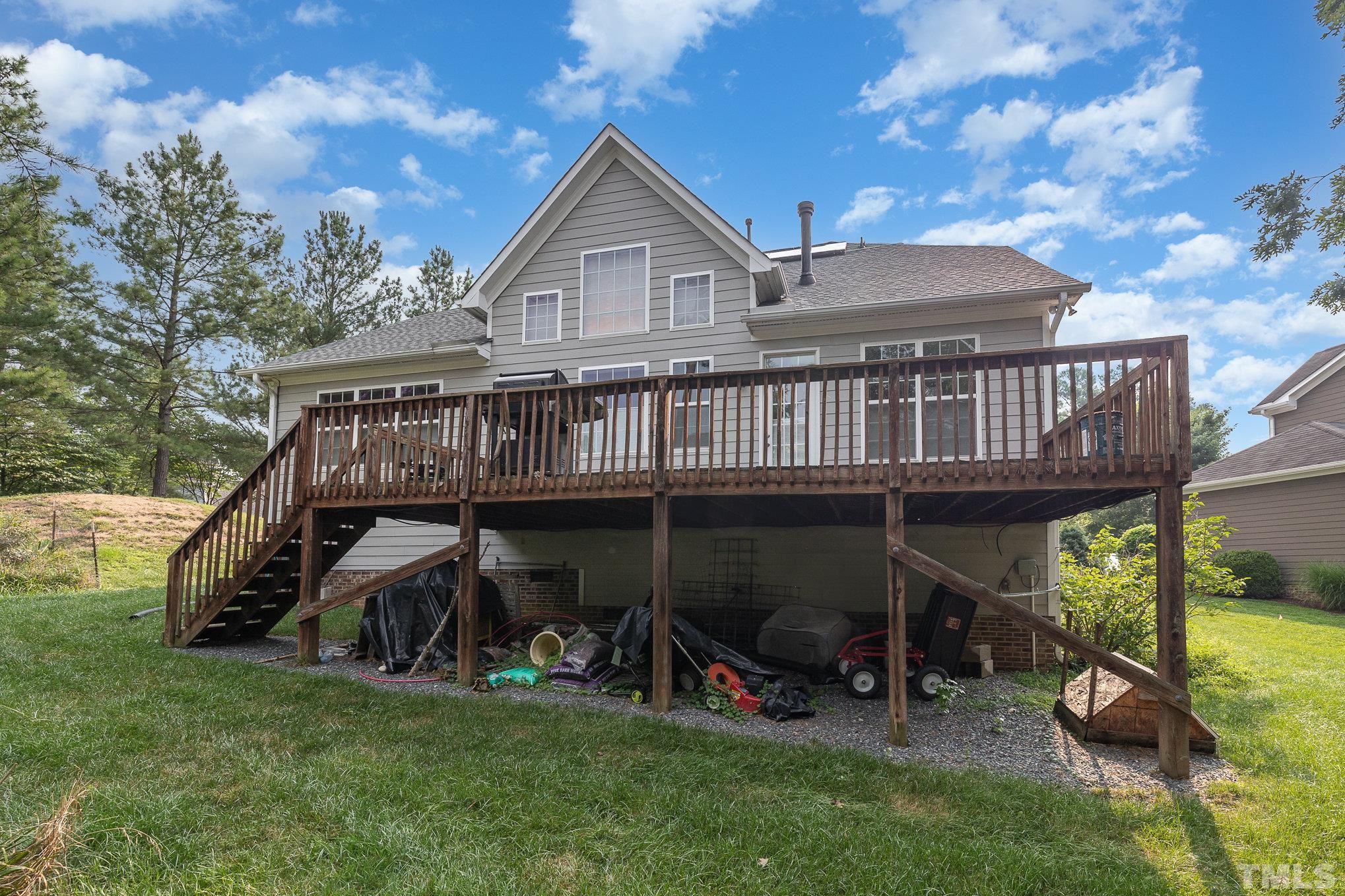 306 Few Circle Durham, NC 27705 - Photo 24 of 28 a view of a house with a yard and deck area under a large tree
